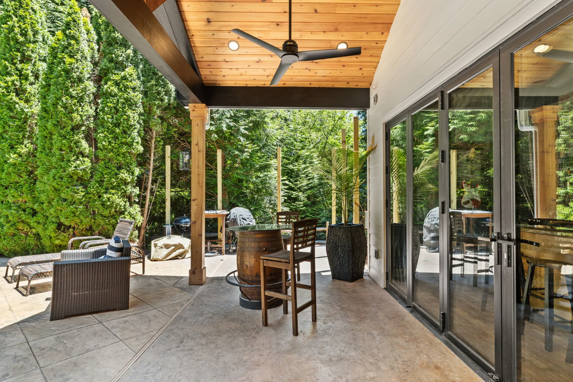Covered patio with a vaulted wood ceiling in Cumming, GA by HomeVantage