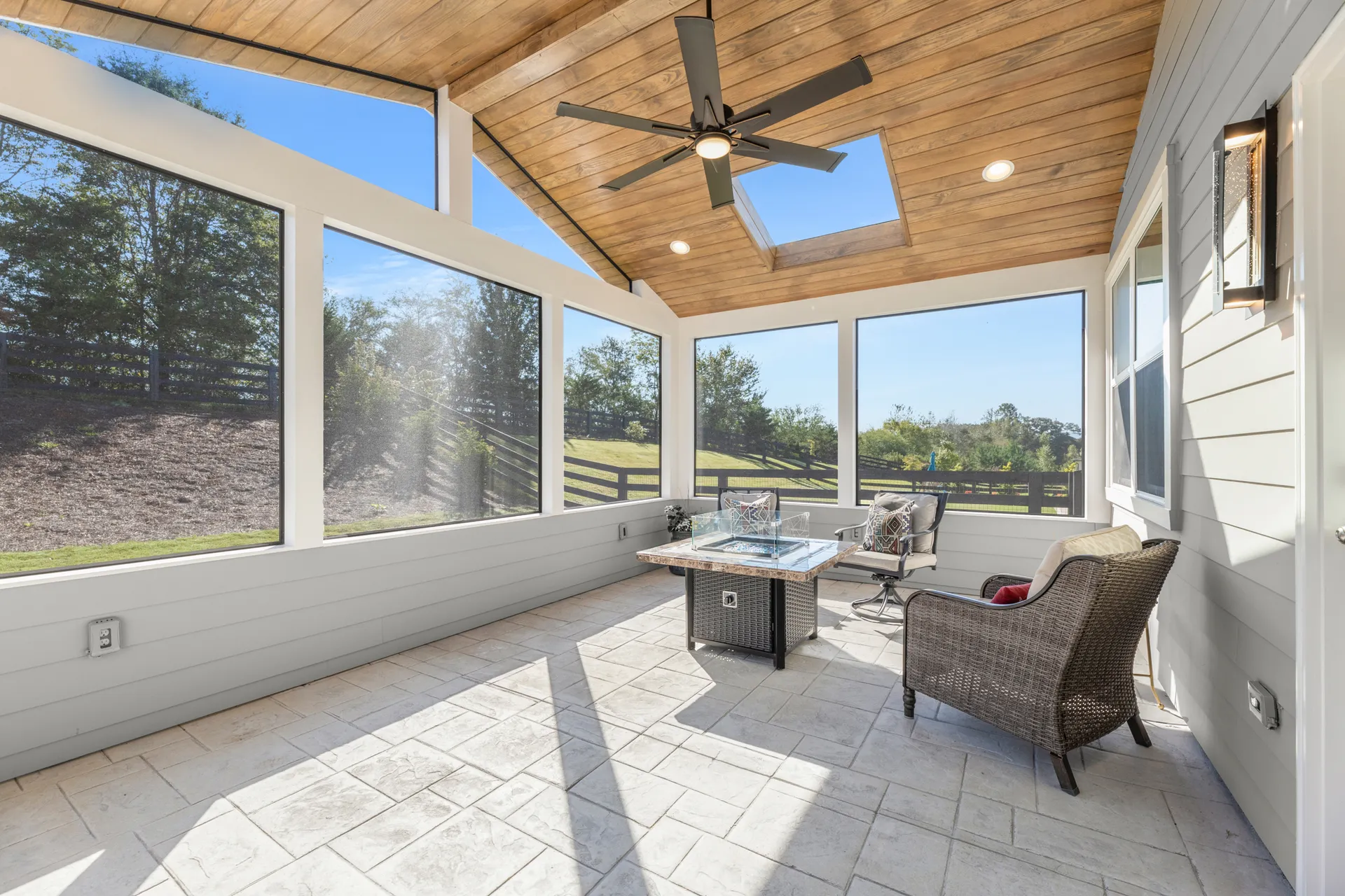 Covered patio with a vaulted wood ceiling in Cumming, GA by HomeVantage